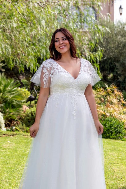 V-neck tulle sleeve plus size wedding gown perfect for spring or outdoor ceremonies
