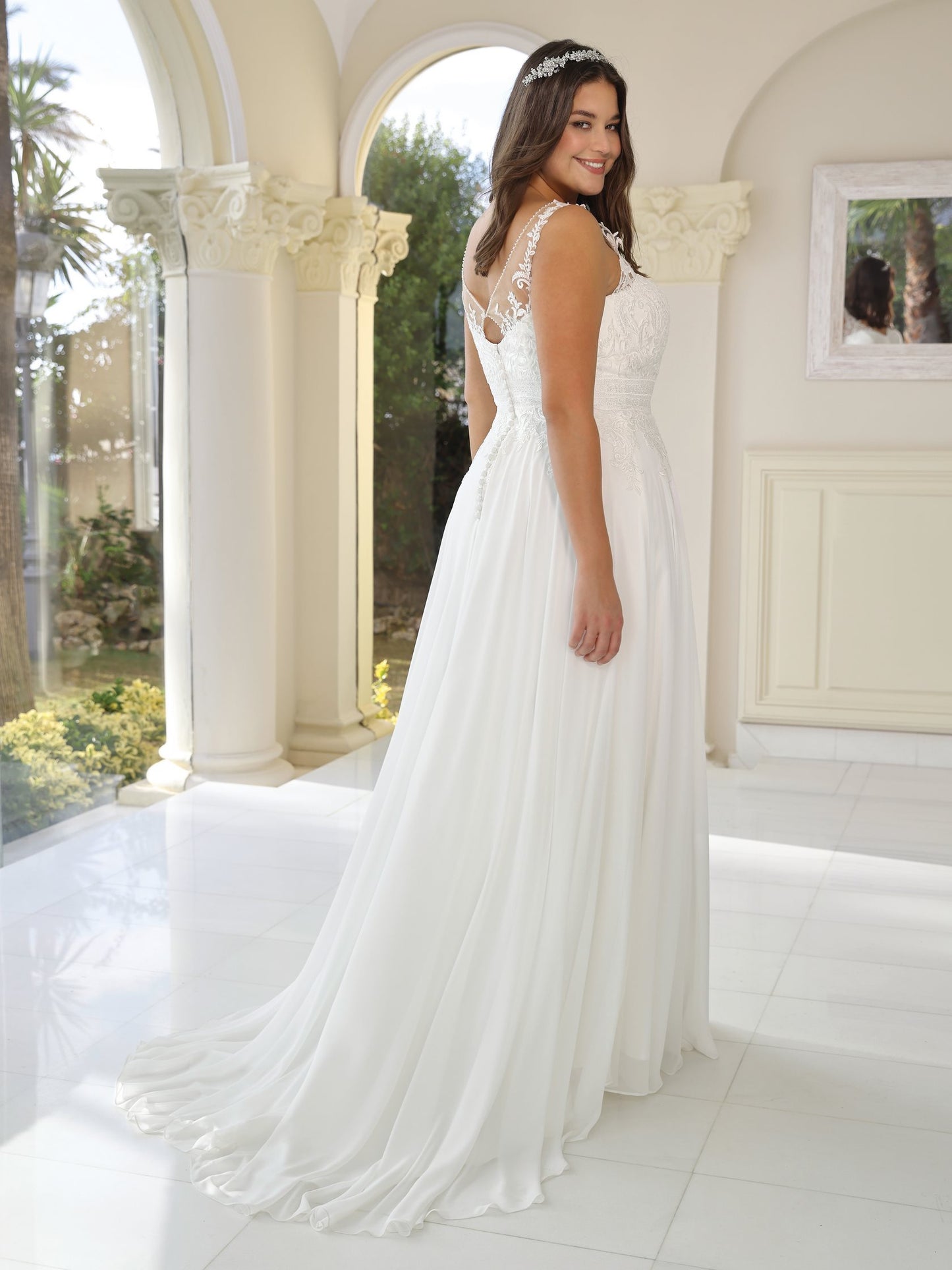 Back view of boho plus size chiffon wedding dress with lace