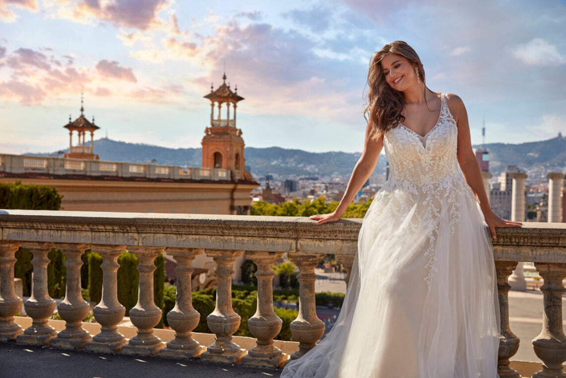 Elegant bridal gown with back button detail and illusion lace