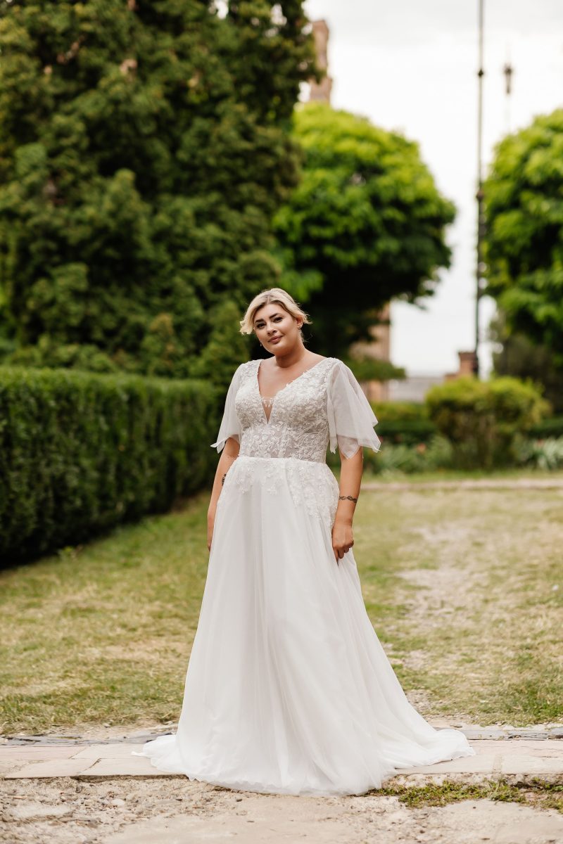 Lightweight chiffon A-line gown designed for plus-size brides with rustic, vintage flair