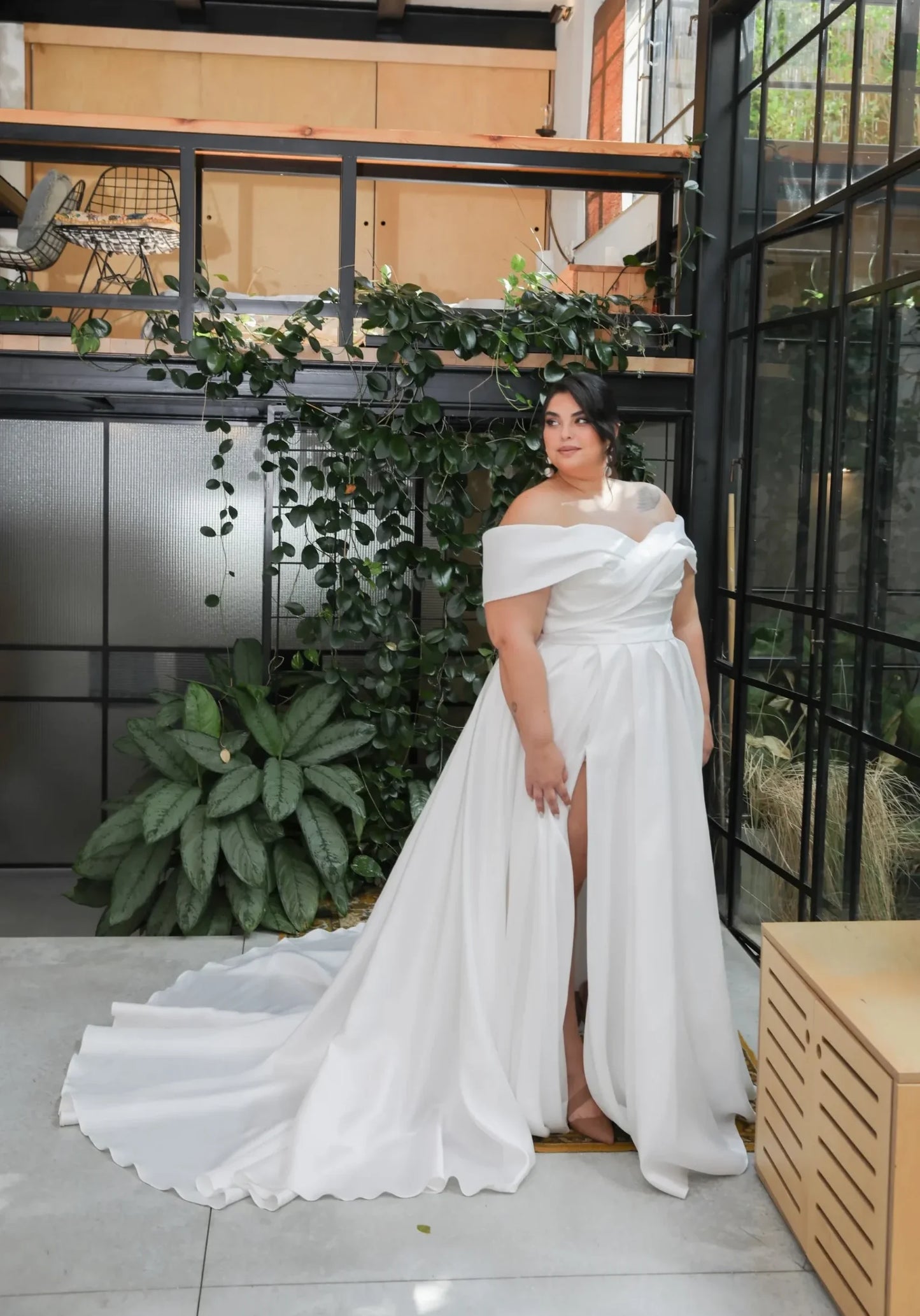 Satin A-line gown with court train and structured bodice for curvy bride