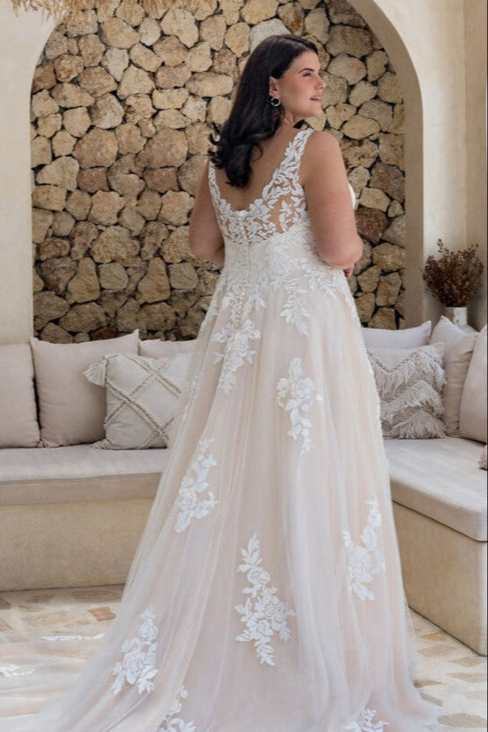 Floral applique gown designed for plus size brides seeking whimsical elegance