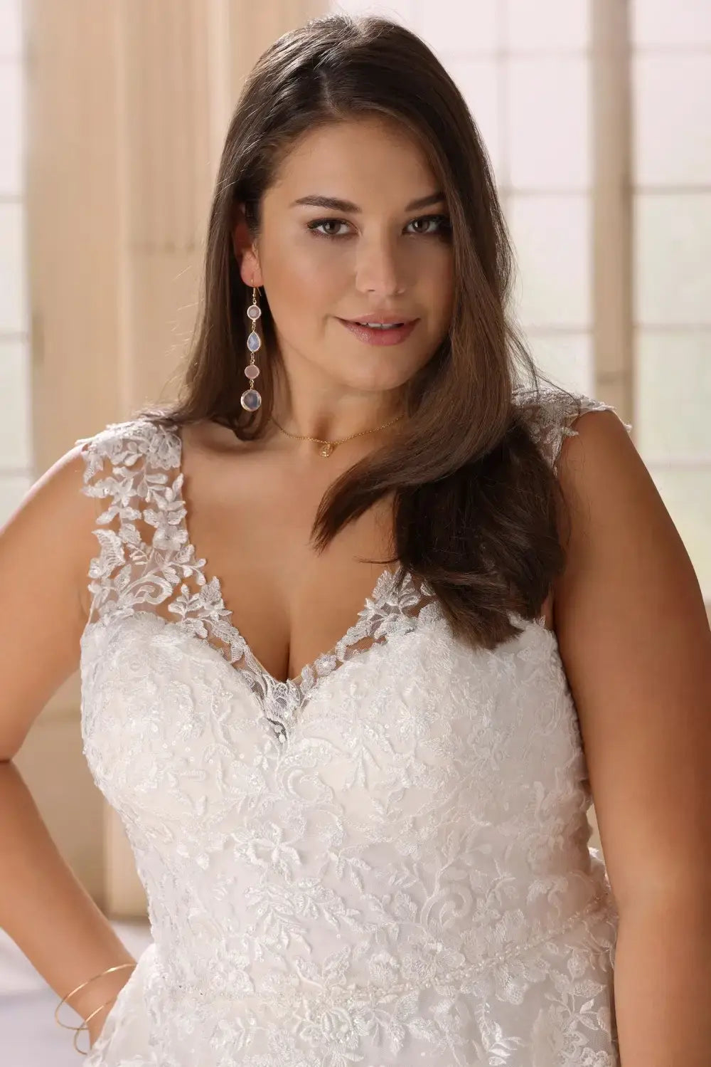 Back view of glitter lace wedding gown with illusion back for plus size bride