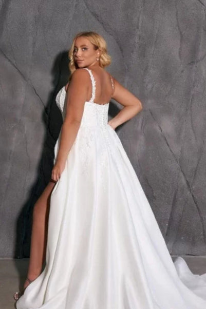 Sleeveless bridal gown with lace applique and satin finish