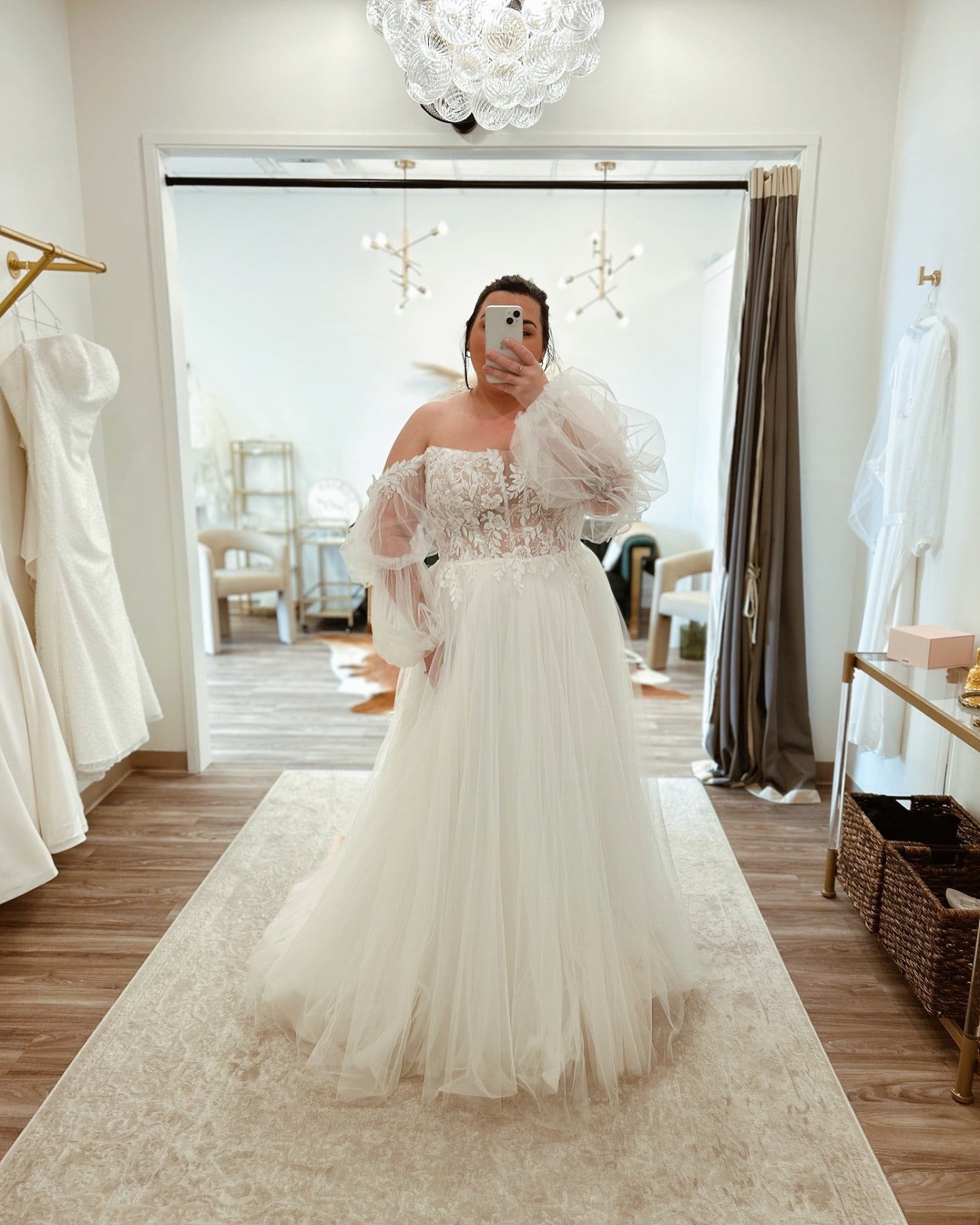 Plus size bridal gown with puff sleeves and floral lace