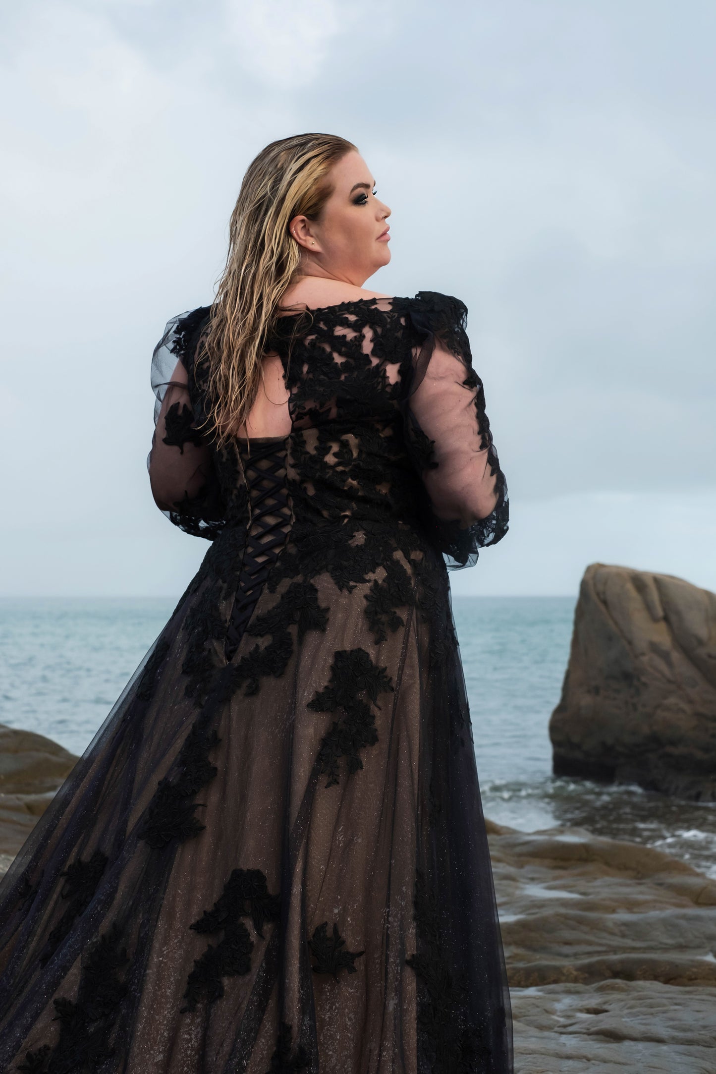 Dramatic black wedding gown with train, perfect for gothic or alternative weddings