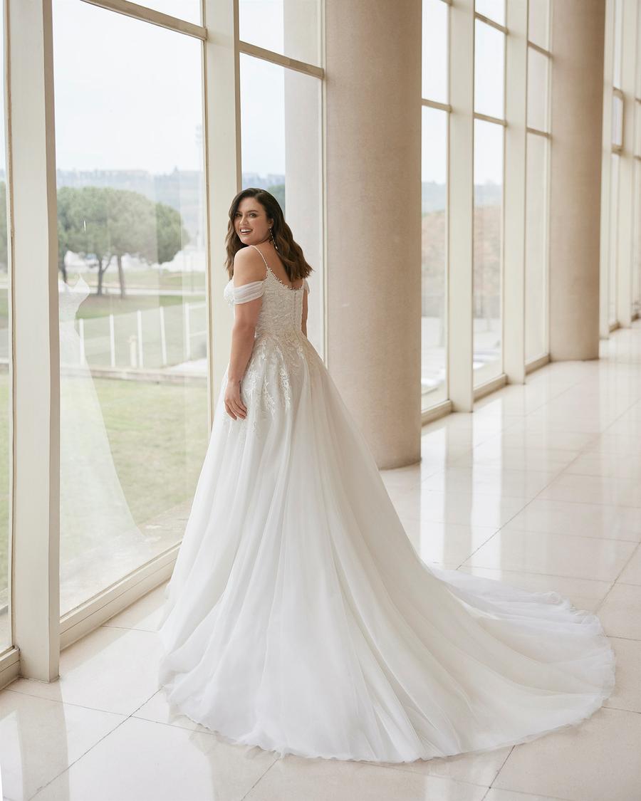 Elegant plus size wedding dress made from lightweight tulle for romantic look
