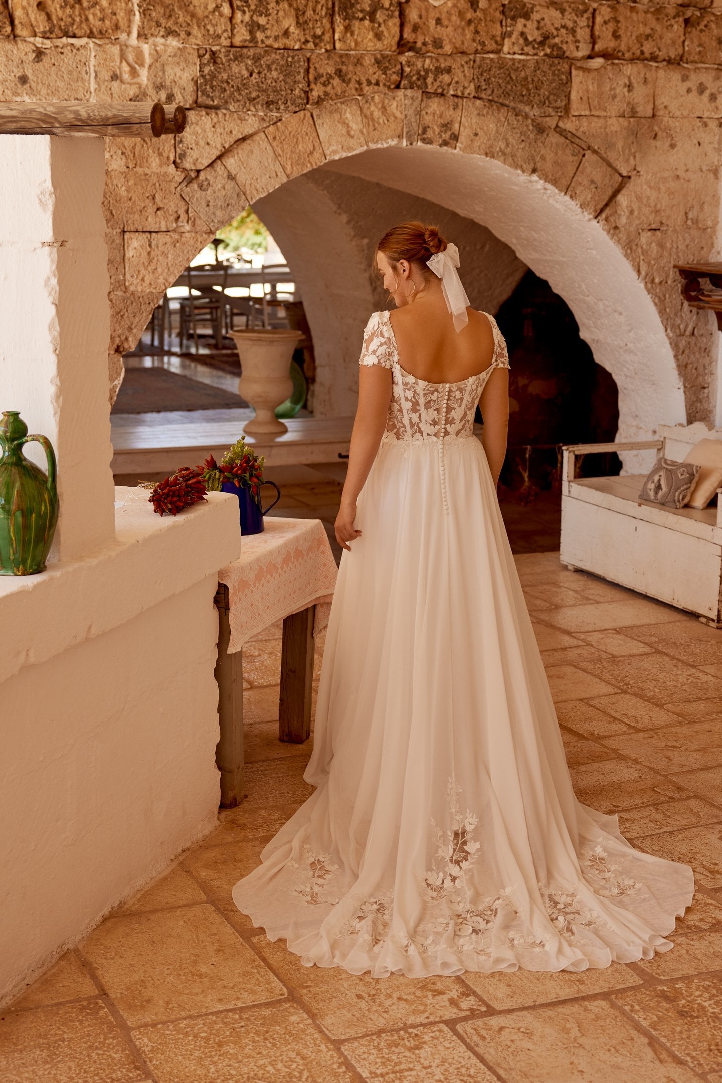 Soft and romantic bridal gown for curvy women with sheer sleeves