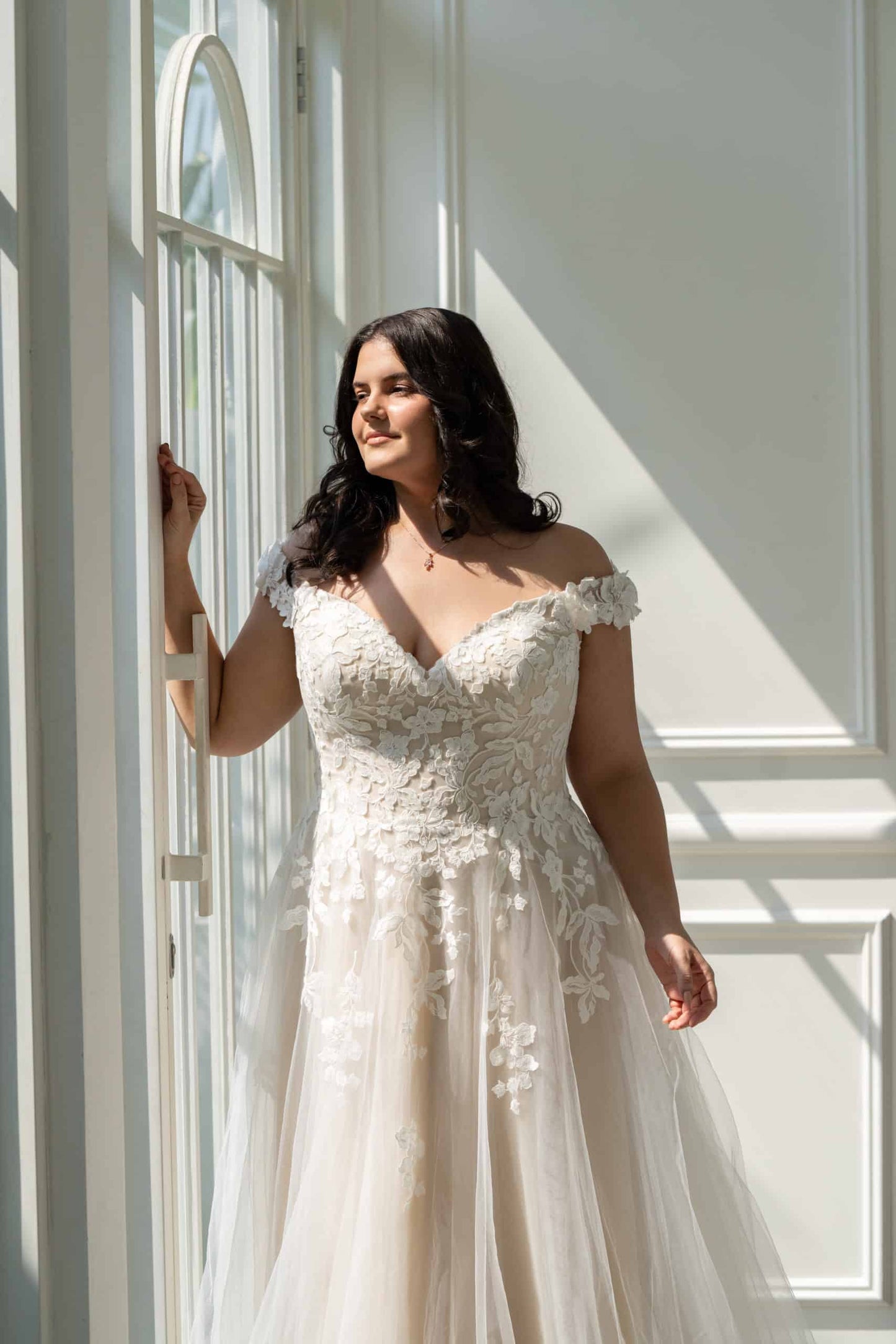 Illusion back bridal gown with floral lace appliqué for curvy brides