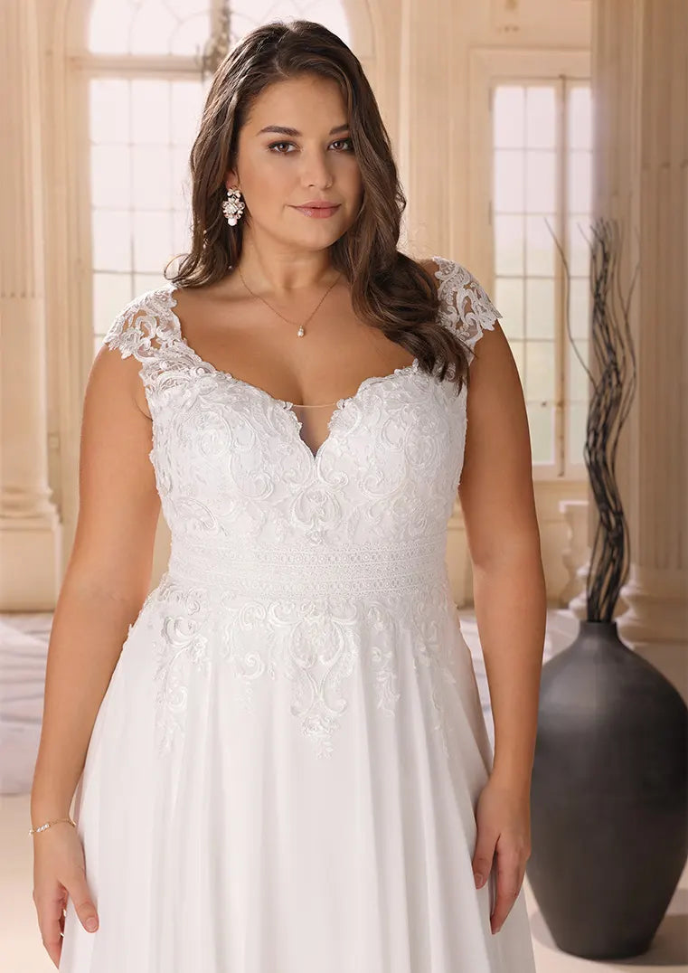 Lace cap sleeve bridal gown for curvy bride with flattering neckline