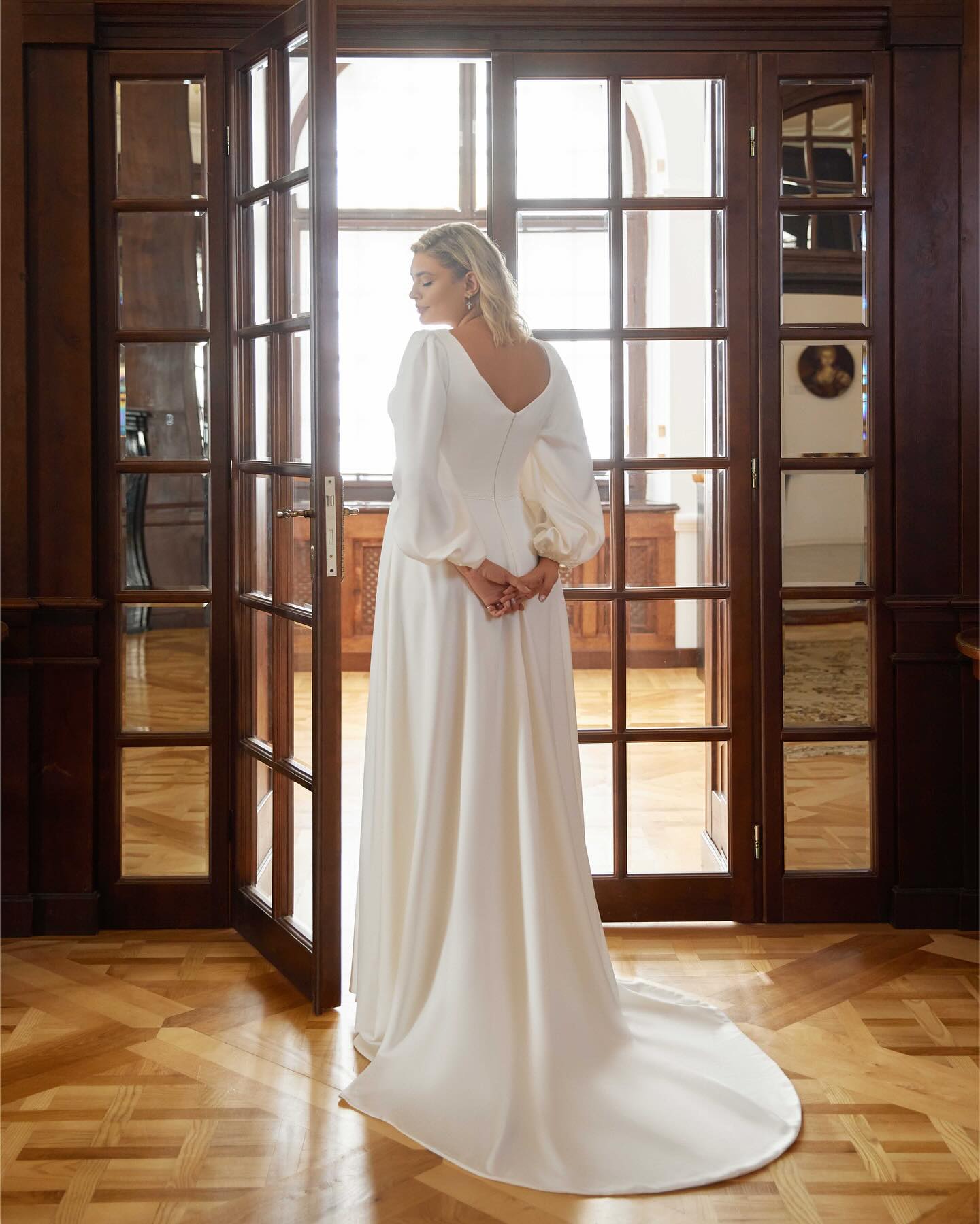 Modern plus size bridal gown with flattering A-line cut and side slit