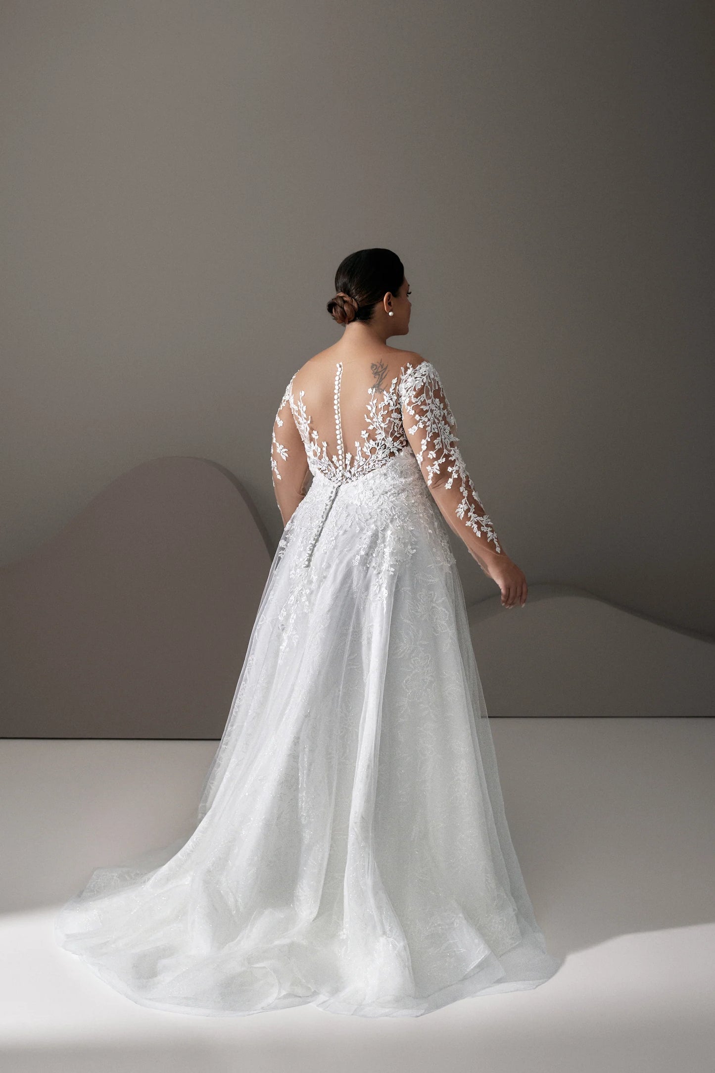 Elegant plus size gown with floral appliqué on bodice
