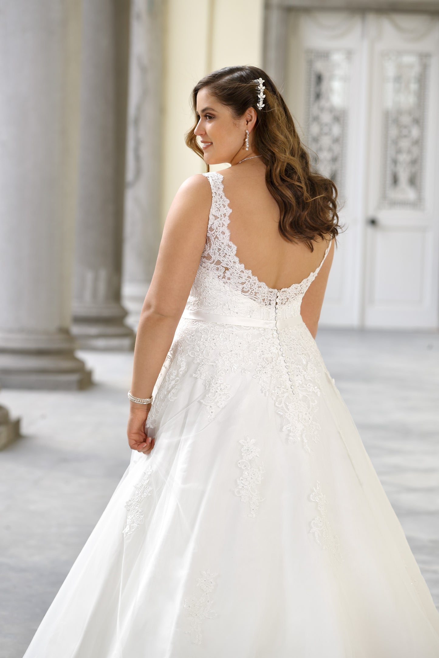 Back view of plus size backless lace bridal gown