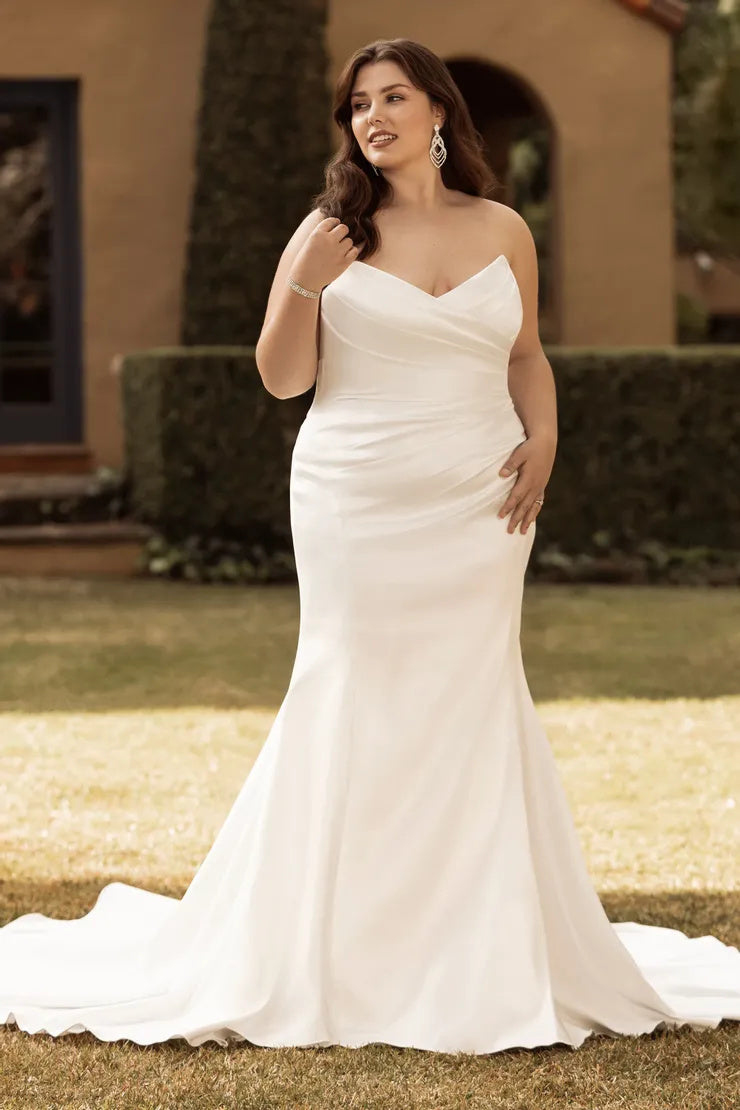 Strapless ivory mermaid wedding gown for plus size bride front view