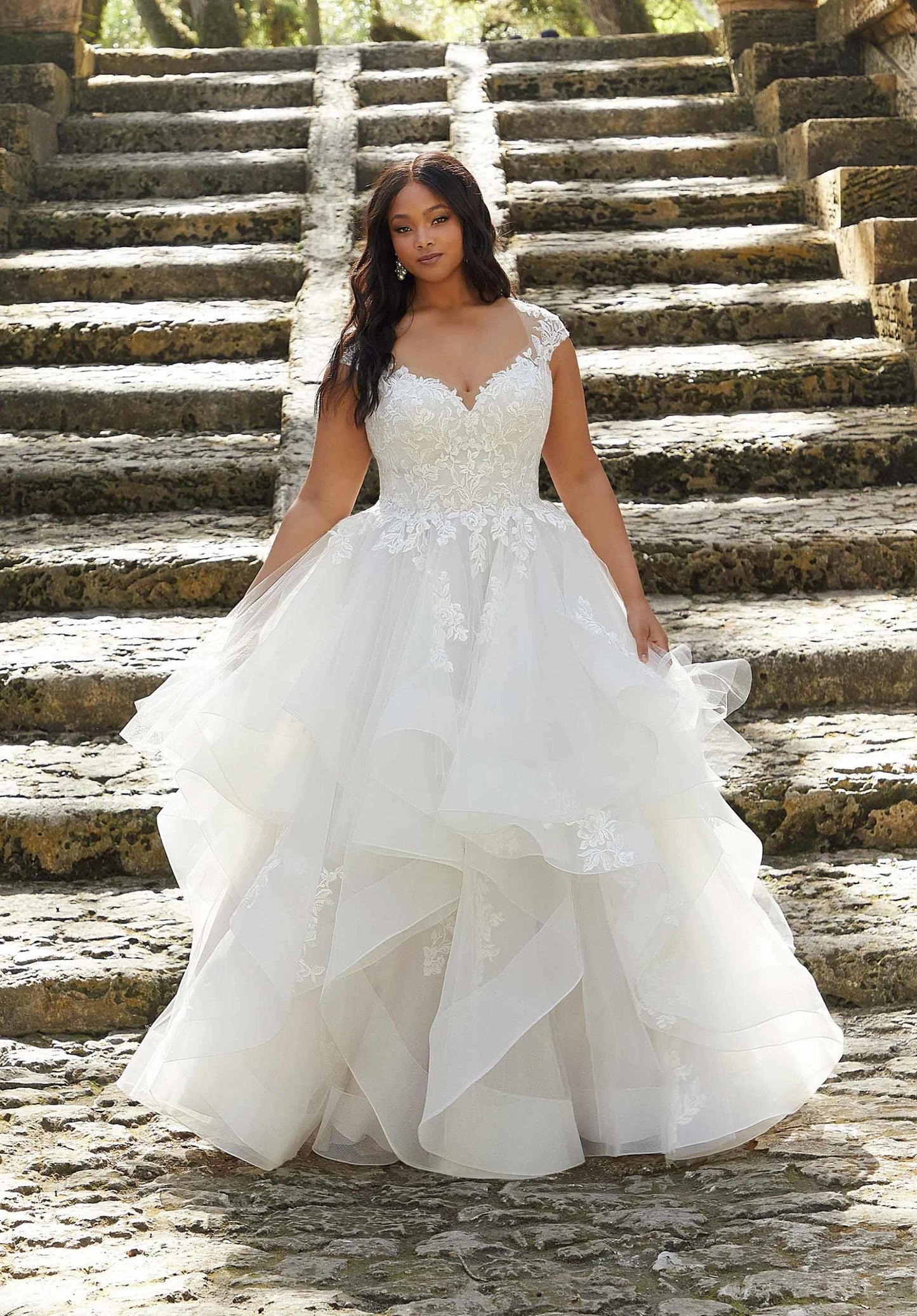 V-neck wedding dress with lace and cap sleeves