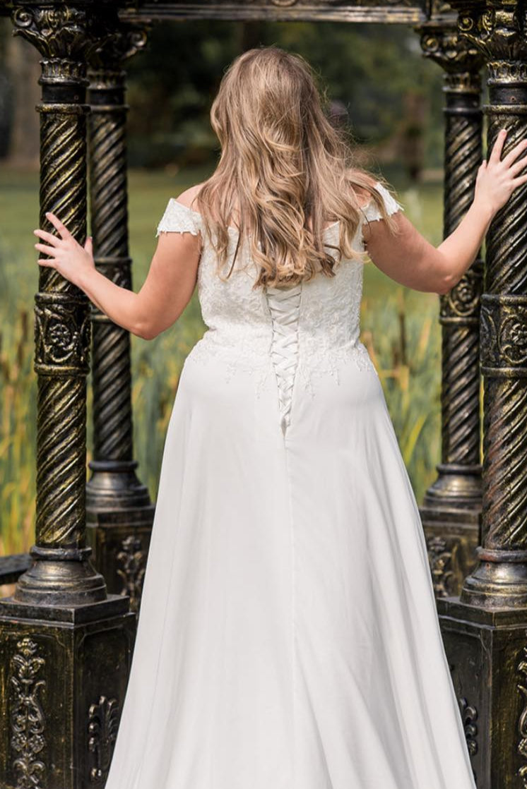 Flowing romantic chiffon wedding dress for full-figure bride