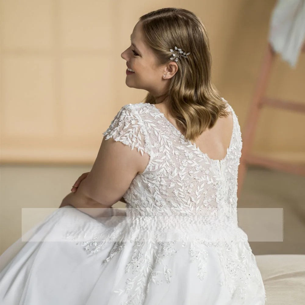 Romantic plus size wedding dress in modern A-line silhouette