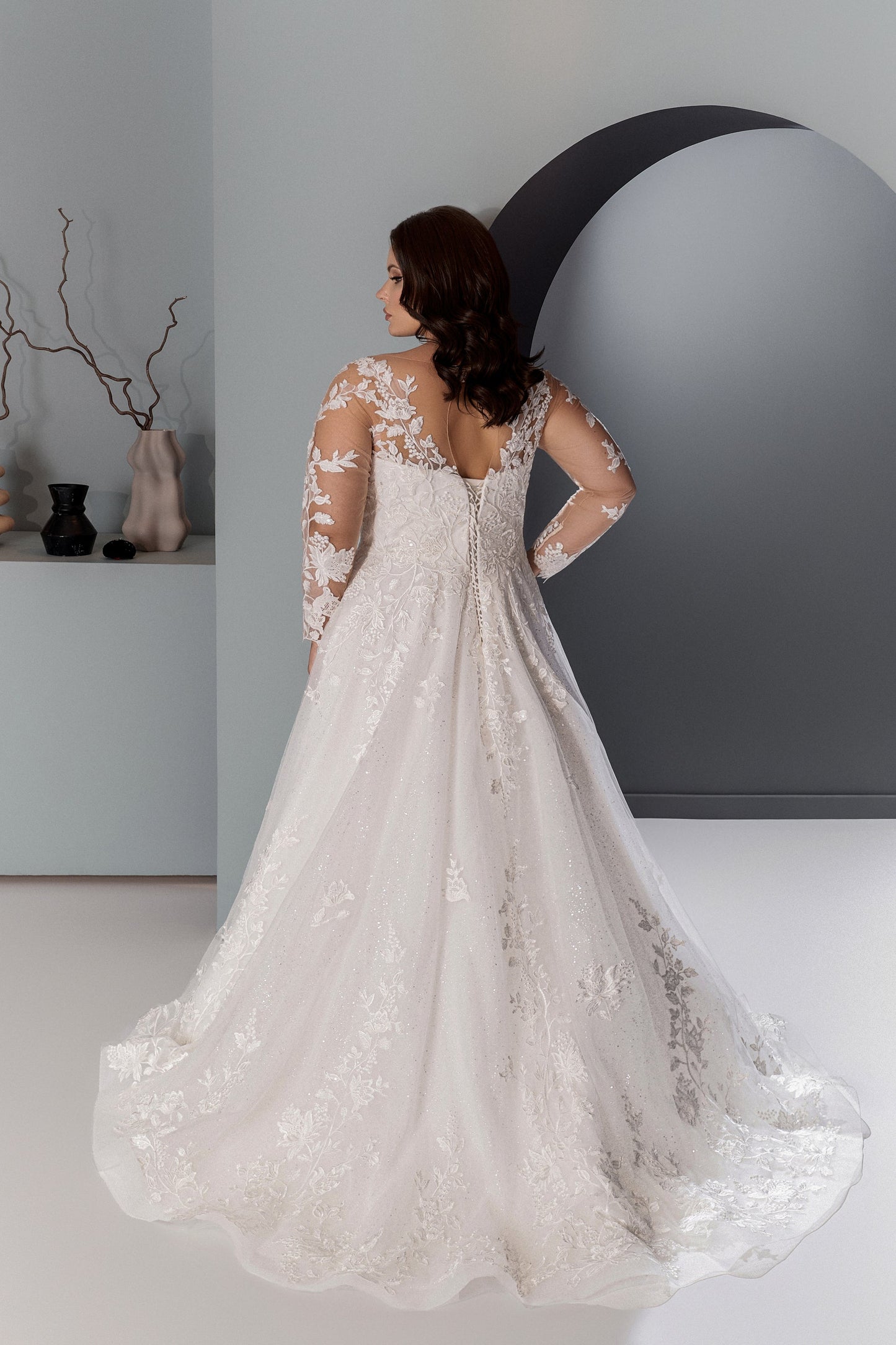 Scoop neck plus size wedding dress with fitted bodice and flowing dress
