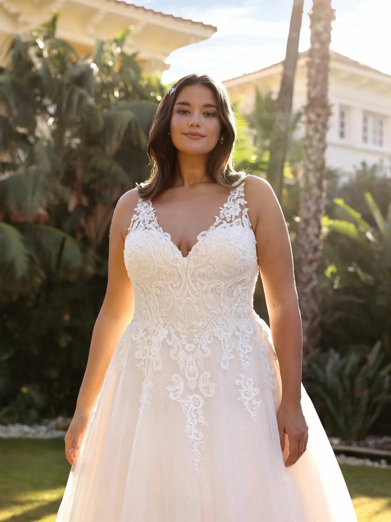 Sleeveless lace and tulle wedding gown for full-figure bride