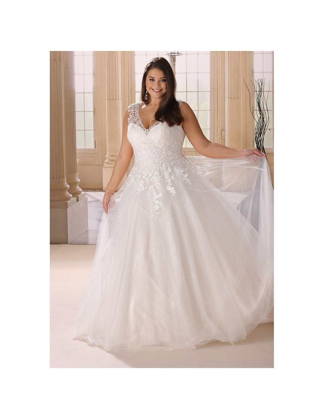 Light-catching tulle wedding gown with shimmer and floral detail