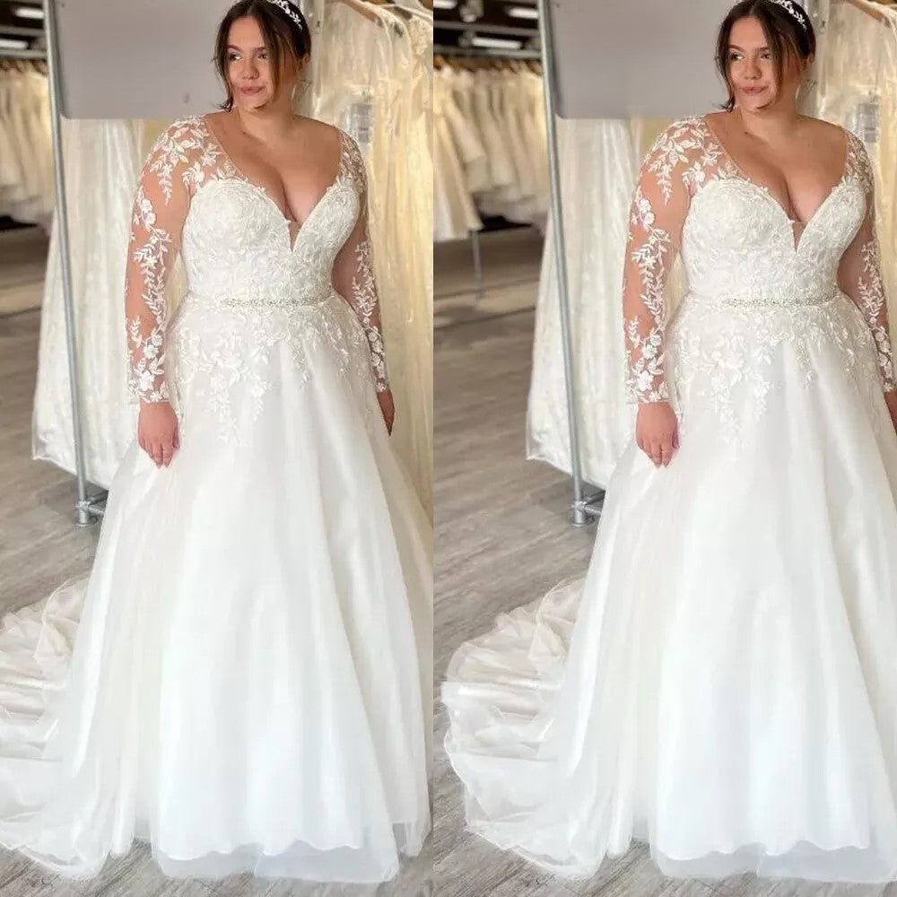 curvy bridal gown with deep v neckline and floral lace appliqué bodice