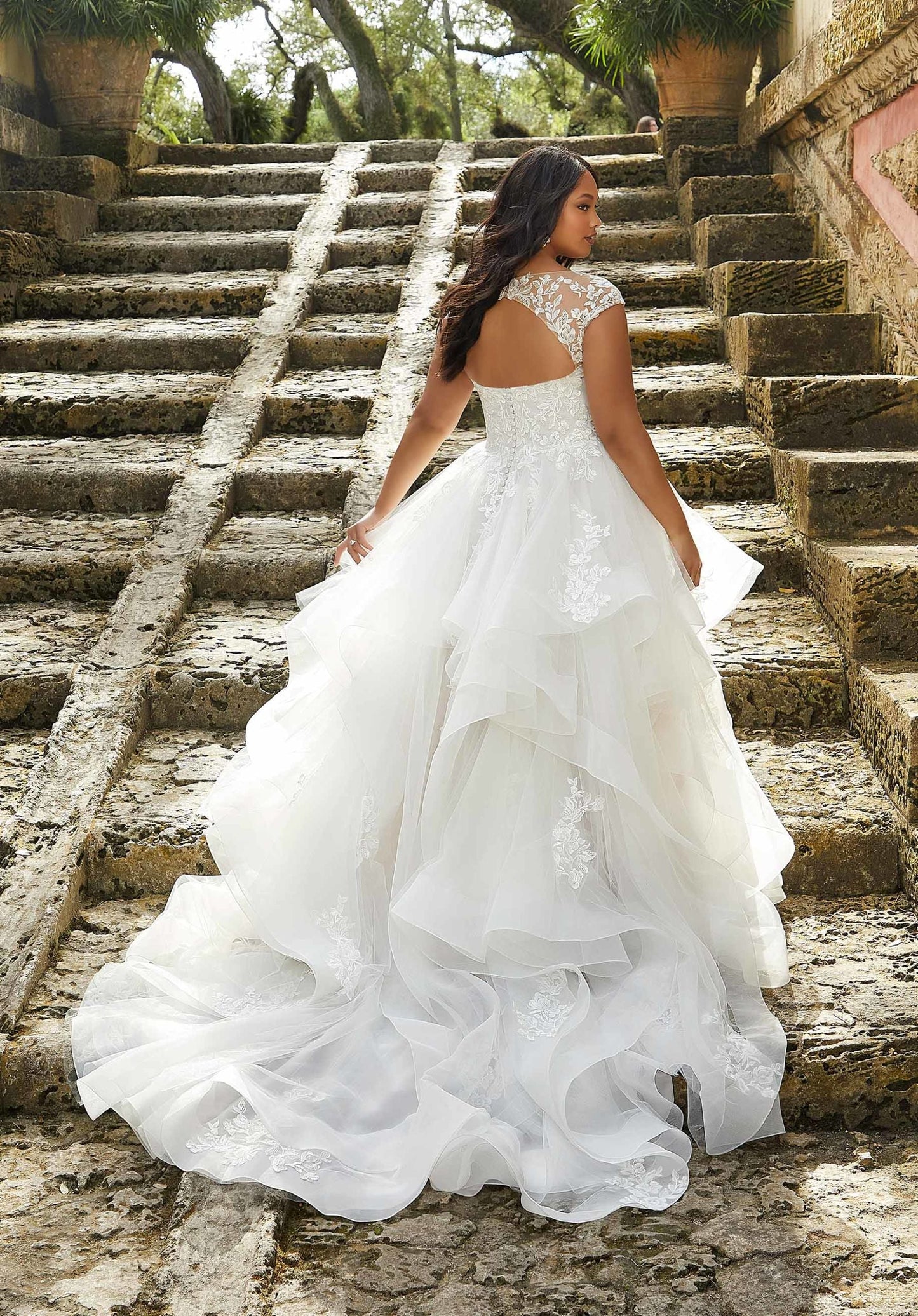 Lace applique bodice wedding gown with volume skirt