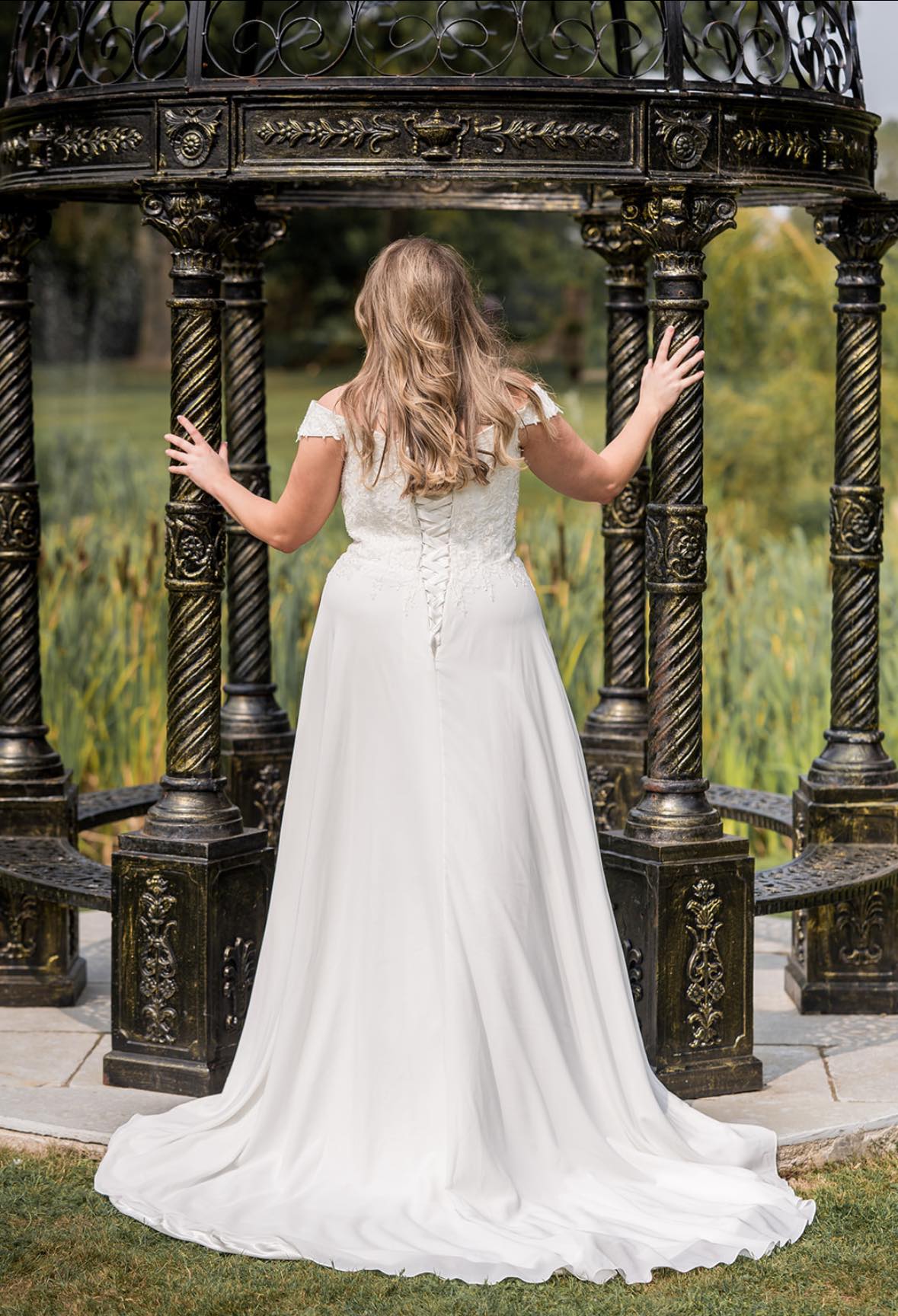 V-neckline boho bridal gown with lace applique and flowing chiffon skirt