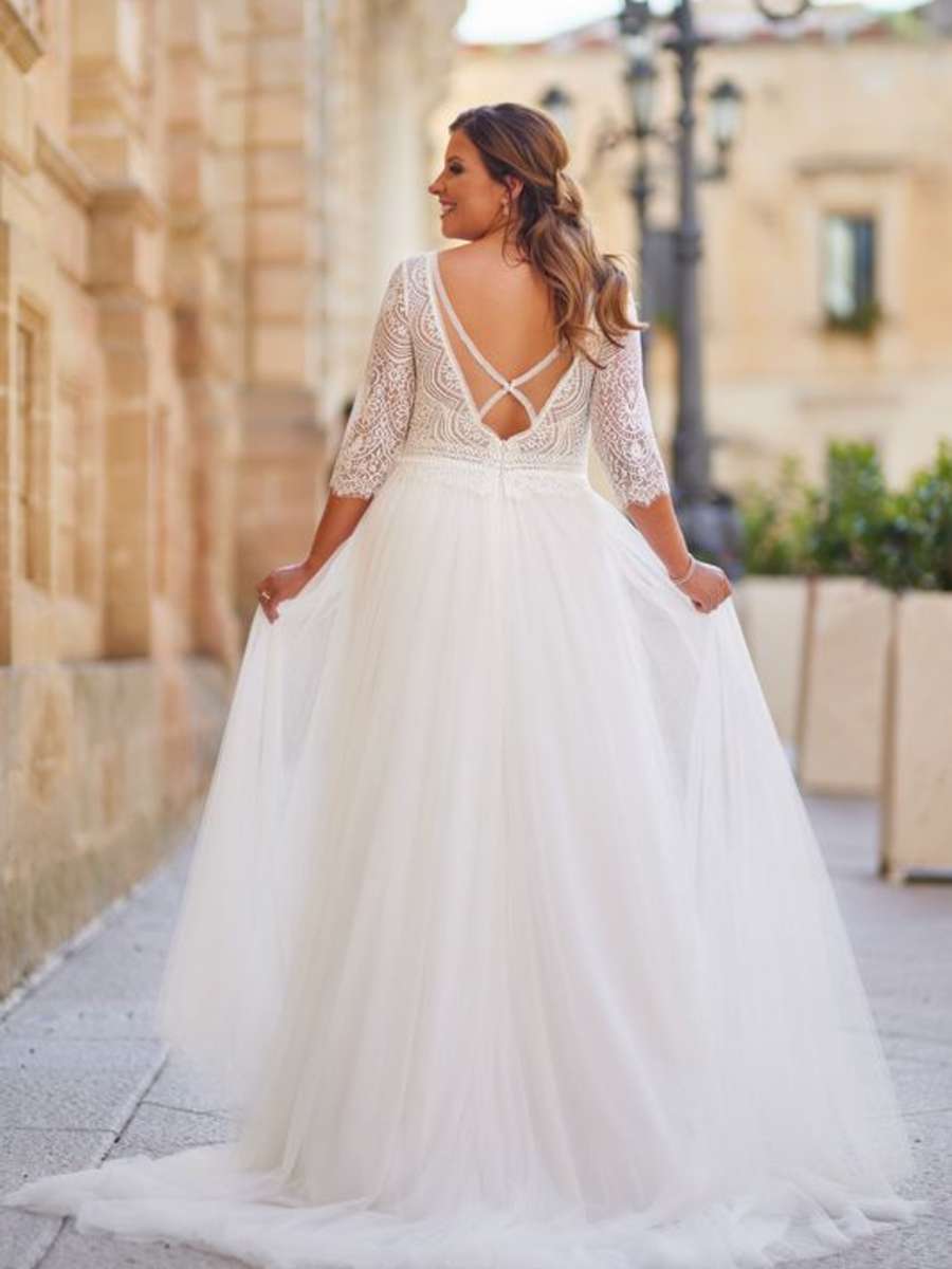 Front view of lace applique V-neck gown for full-figure bride