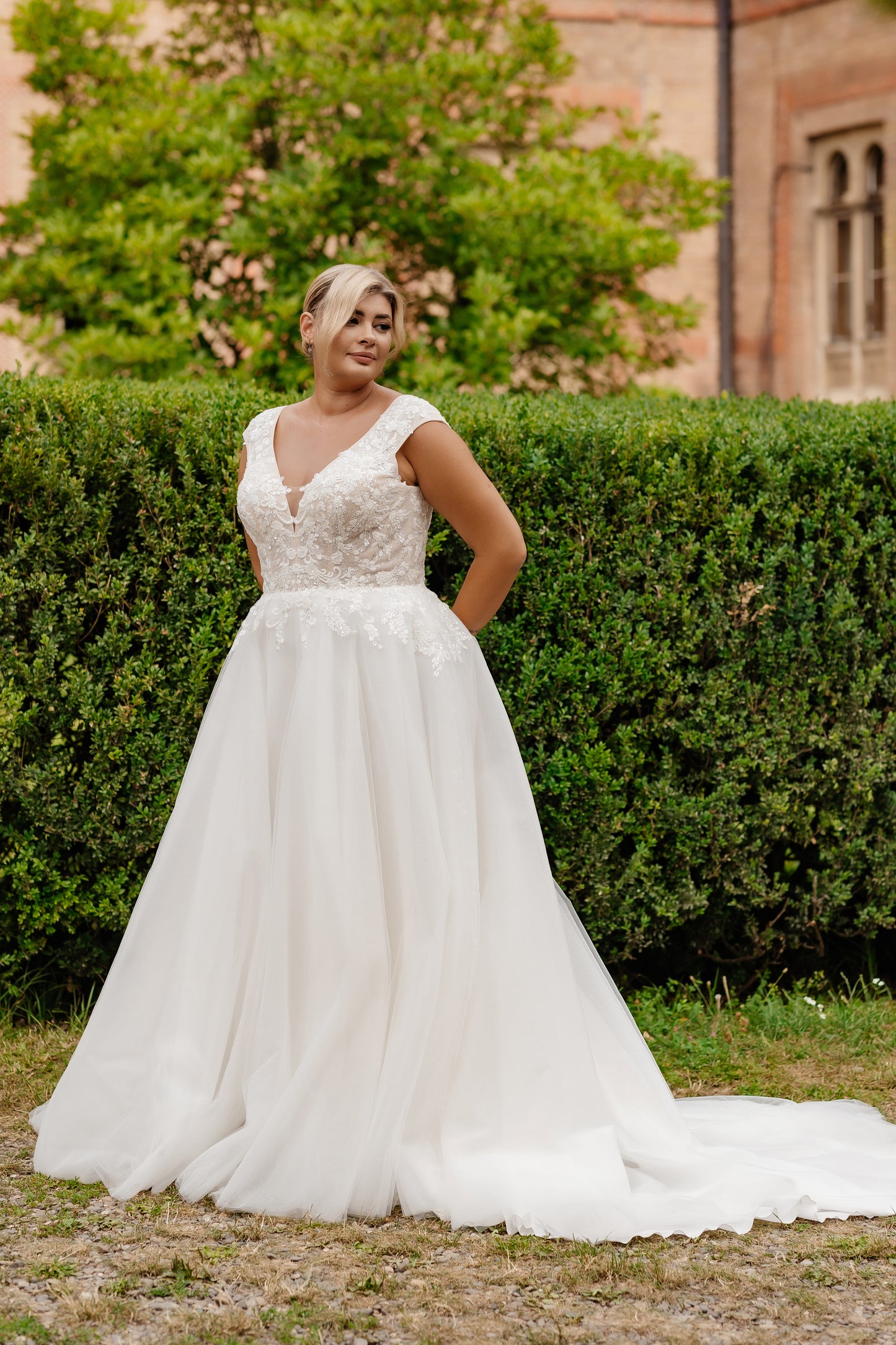 V-neck tulle bridal gown ideal for curvy and full-figured brides
