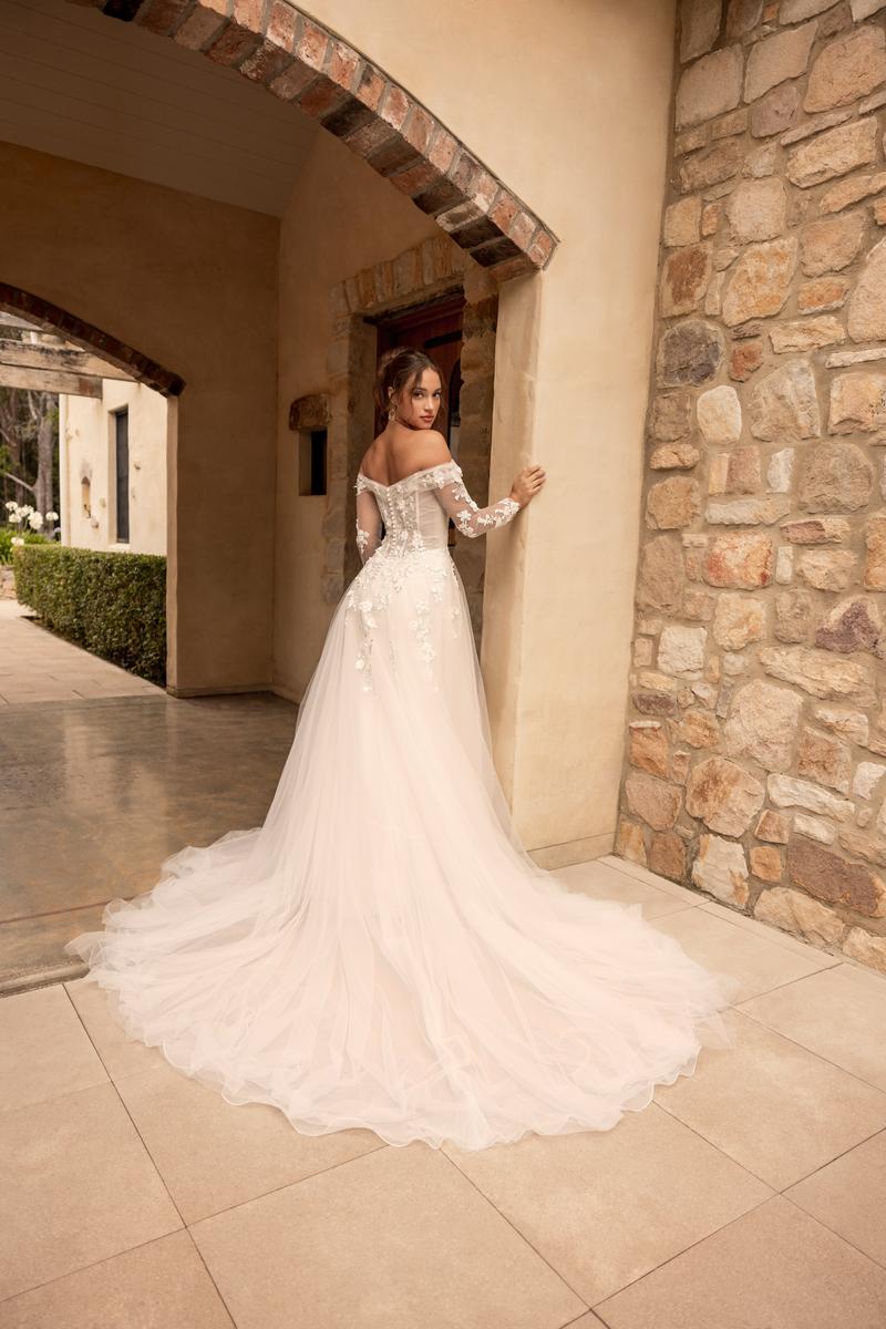 Detailed lace bodice with 3D flowers on a dreamy wedding dress designed for full-figured women

