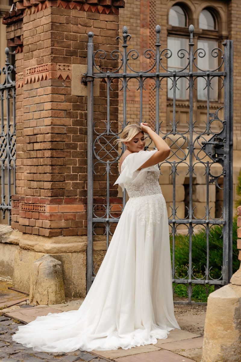 Applique lace bodice with illusion V-neck and airy chiffon skirt, perfect for boho-style weddings

