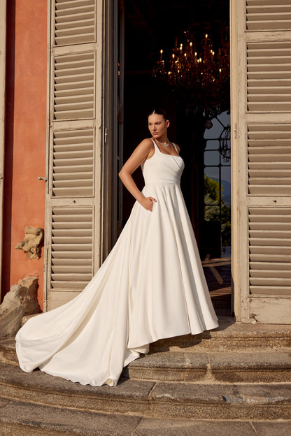 Elegant backless A-line bridal gown with satin train and modern structure