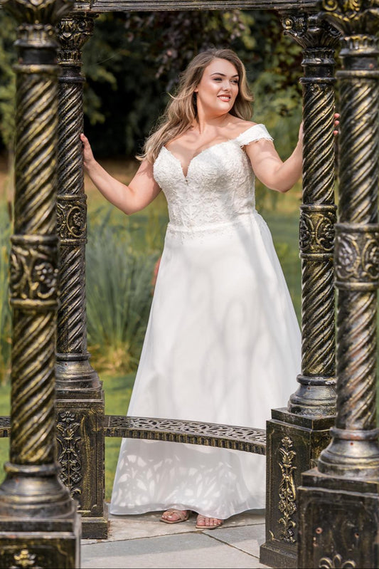 Back view of chiffon A-line wedding dress with lace-up back for curvy bride