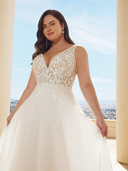 Plus size wedding gown with dramatic chiffon shawl overlay