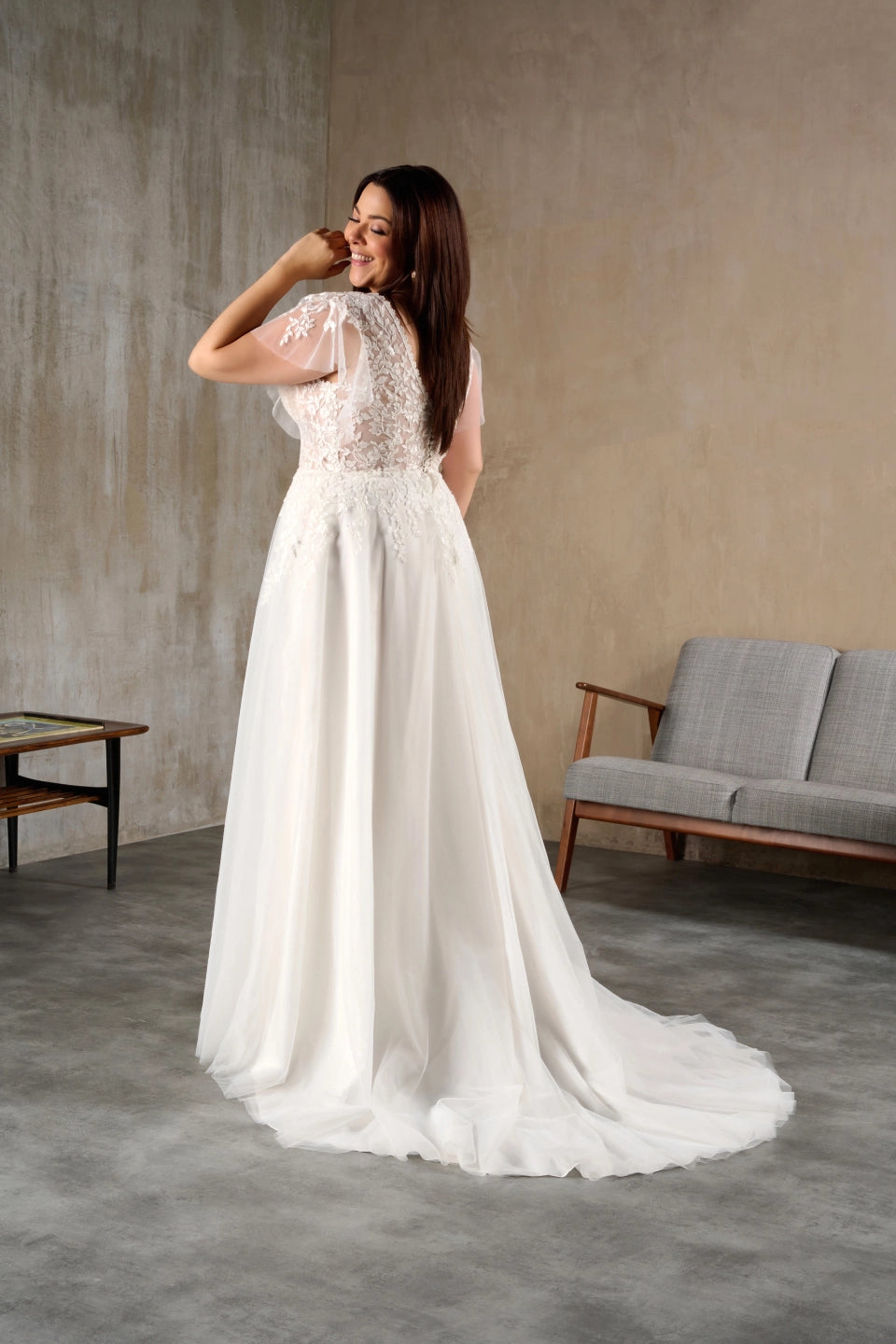 Plus size gown with v-neck and romantic sweep train
