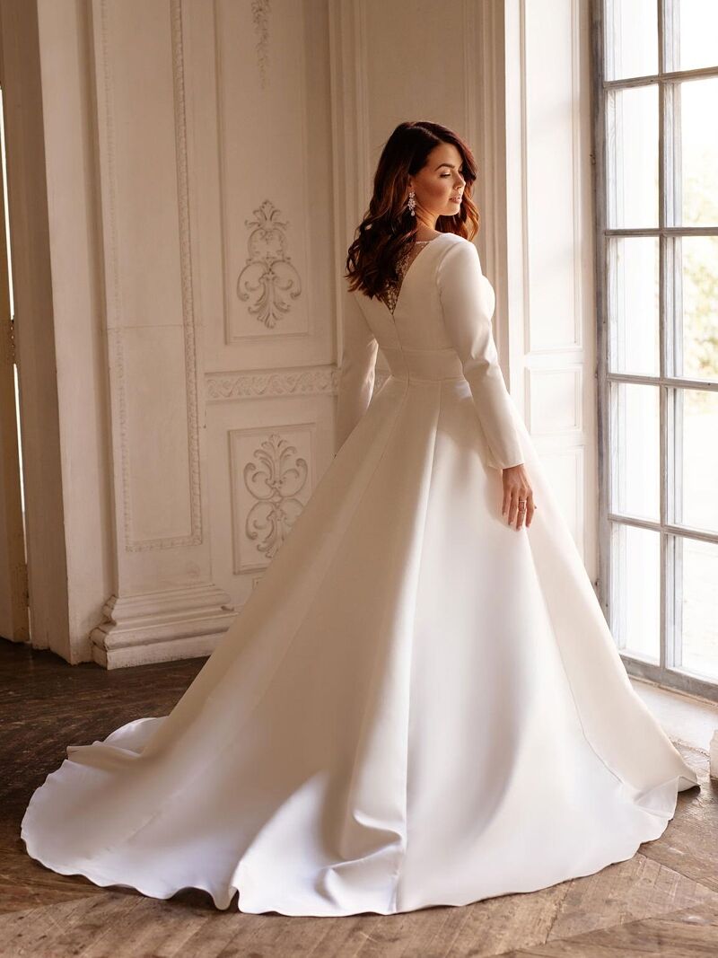 Floor-length formal satin gown for curvy bride with long sleeve elegance