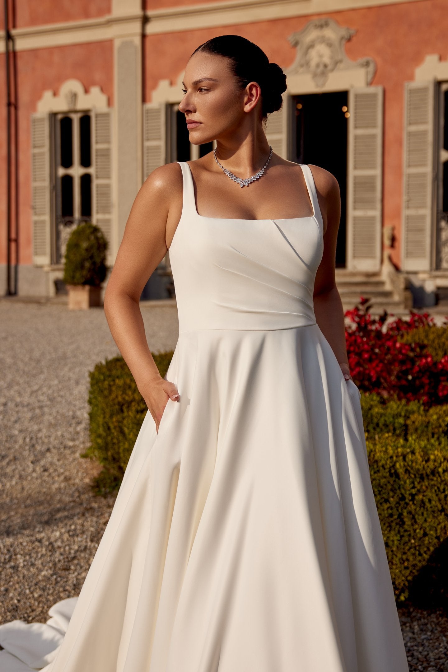 Curvy bridal gown with hidden pockets and soft satin texture