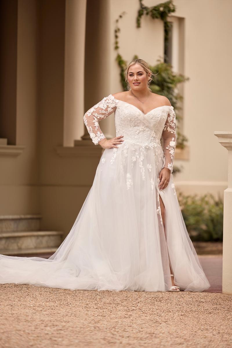 Custom fit oversize wedding dress with flattering off-shoulder neckline and sweeping boho style train