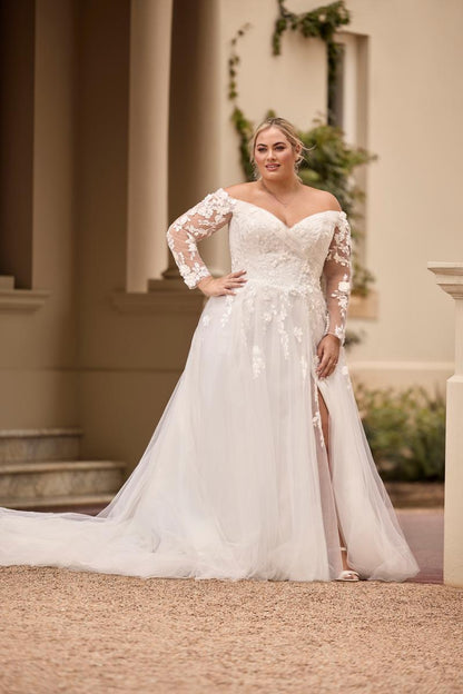 Custom fit oversize wedding dress with flattering off-shoulder neckline and sweeping boho style train