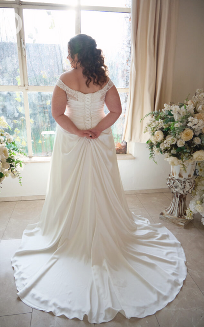 Chapel train detail on elegant plus size wedding dress