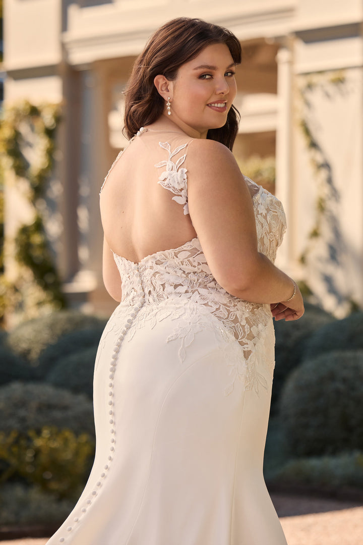 Elegant plus size bridal gown with lace appliqué bodice