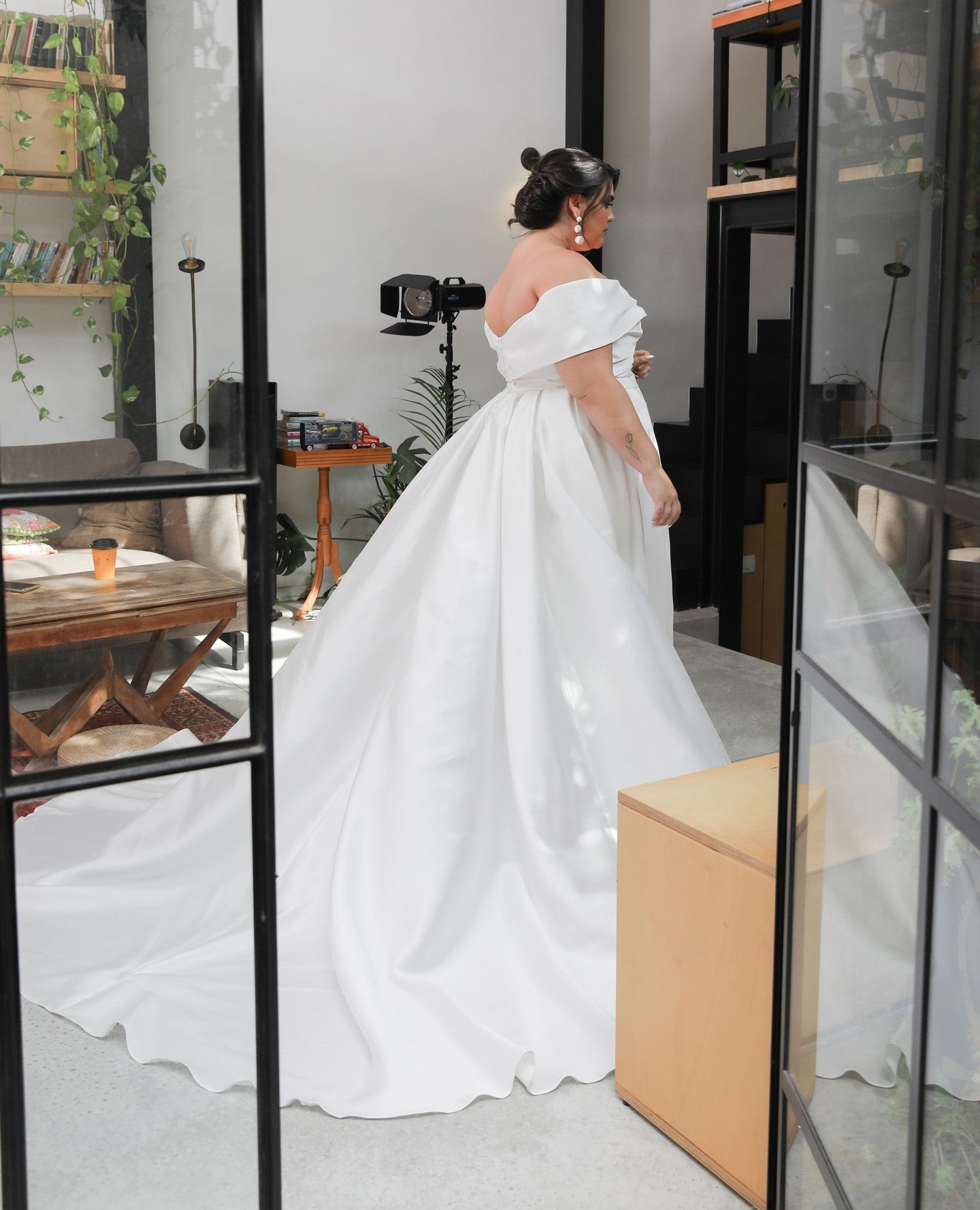 Elegant 2024 satin wedding gown with off-shoulder neckline for plus size bride
