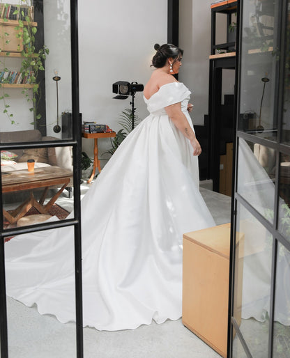 Elegant 2024 satin wedding gown with off-shoulder neckline for plus size bride