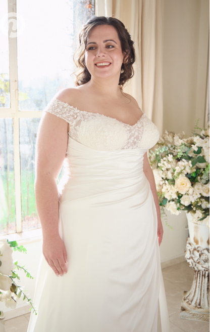 Figure-flattering plus size bridal gown with ruched pleated bodice