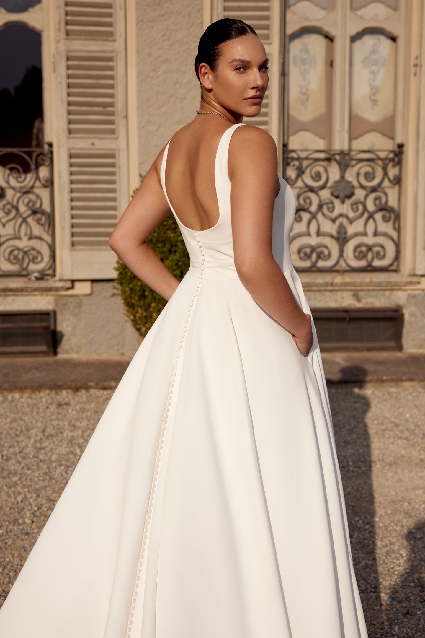 Ivory A-line wedding gown for full-figured brides seeking timeless style