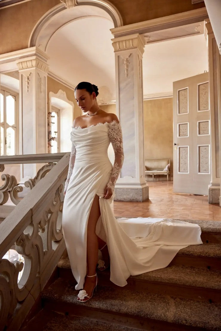 Lace long sleeve bridal gown for curvy women with dramatic silhouette