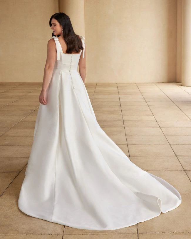 Minimalist plus size wedding dress with smooth satin and flattering A-line silhouette