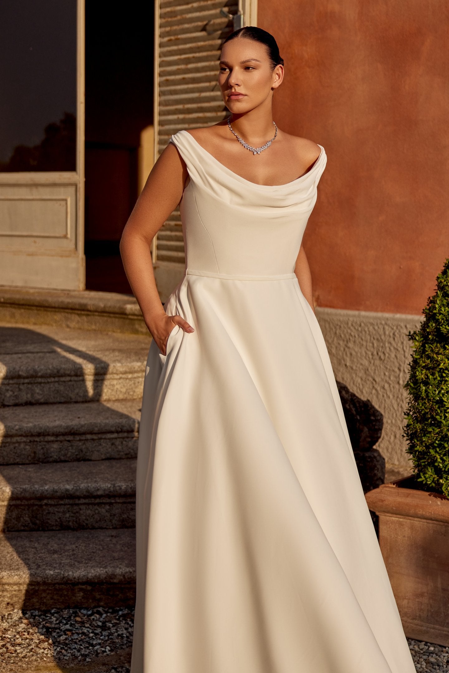 Minimalist plus size wedding dress in satin with flattering A-line cut