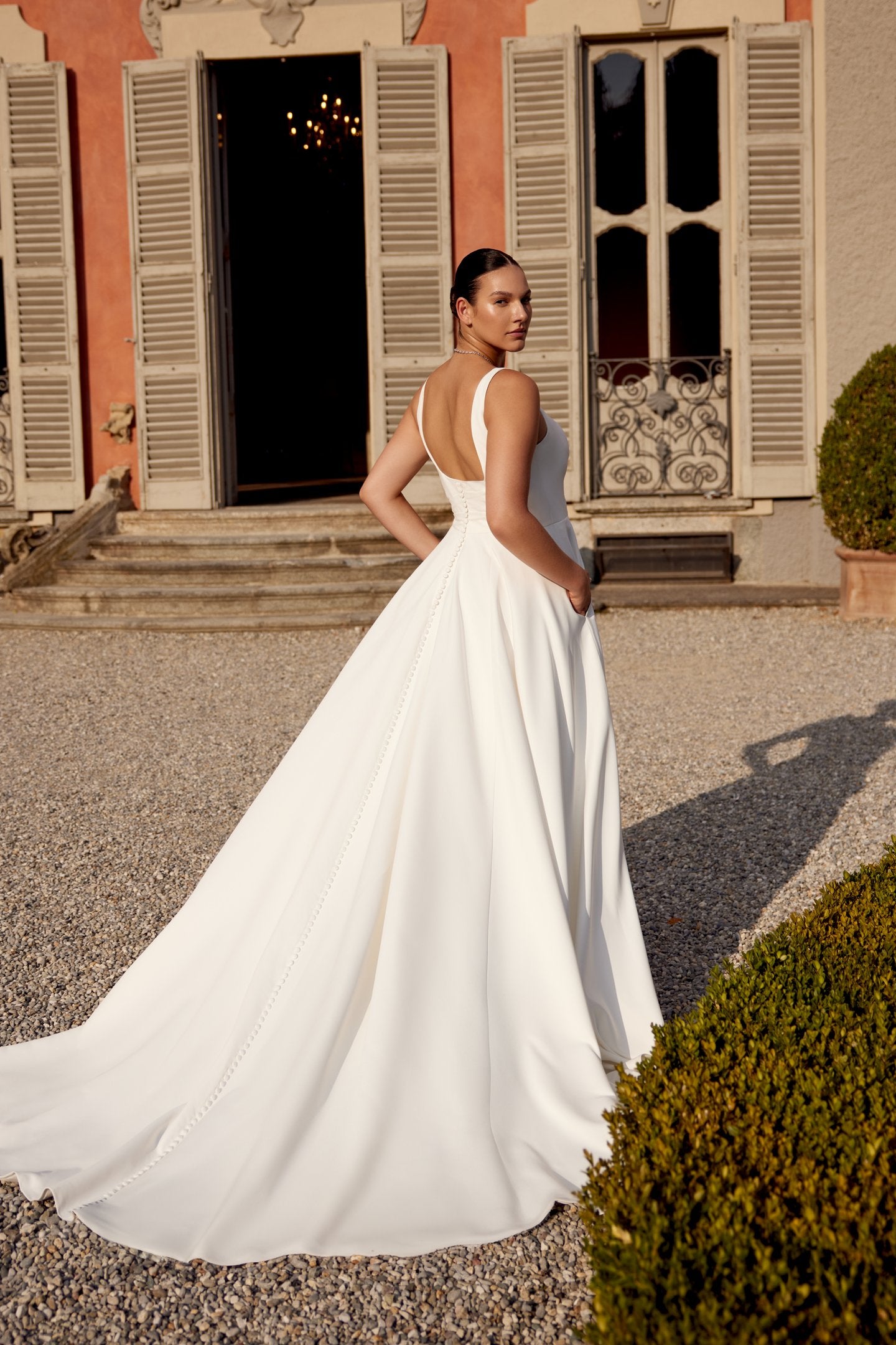 Minimalist plus size wedding gown with supportive bodice and sleek lines