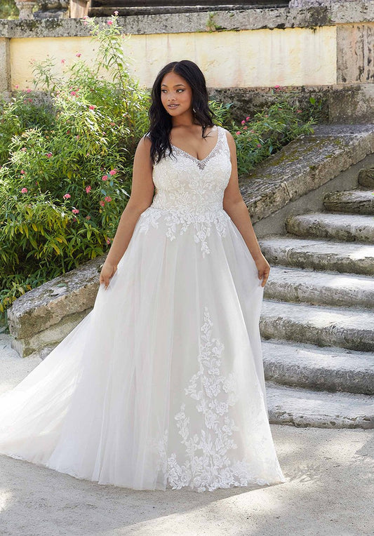 Plus size lace A-line wedding dress with floral appliqué and sleeveless bodice